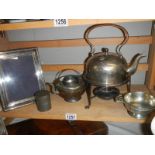 A silver plate kettle on stand and other silver plate.