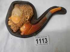 An old cased Meerscham pipe of a man's head.