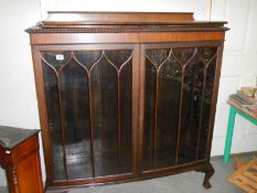 An Edwardian astragal glazed cabinet on ball and claw feet, COLLECT ONLY.
