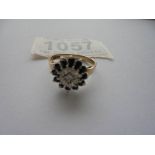 A diamond and sapphire ring in 9ct gold hall marked Birmingham 1976 size M half.