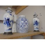 A pair of Chinese blue and white lidded vases (a/f some signs of repair) & blue and white ginger jar