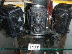 Three vintage camera's.