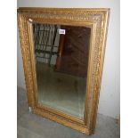 A gilt framed bevel edged mirror (damage to one corner of frame) COLLECT ONLY.