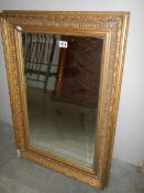 A gilt framed bevel edged mirror (damage to one corner of frame) COLLECT ONLY.