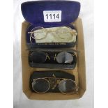 Three cased pairs of vintage spectacles.