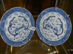 A pair of hand painted Japanese blue and white plates.