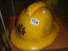 A vintage Lincolnshire fire brigade helmet,