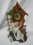 An early 20th century bisque porcelain mantel clock in working order.