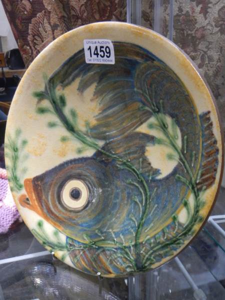 A signed hand painted dish featuring fish (possibly Cornish).
