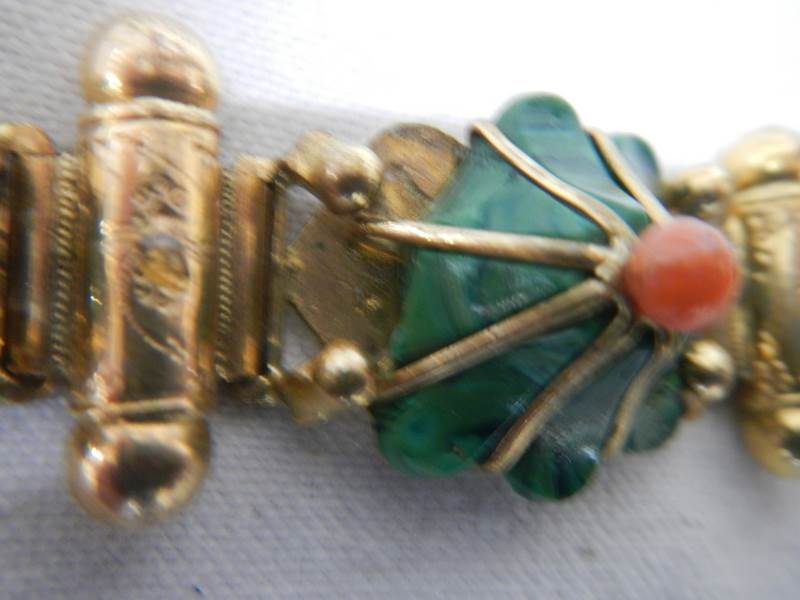 A yellow metal bracelet with flower shapes in green stone with red centre's - Image 5 of 5