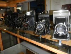 Six vintage folding camera's.