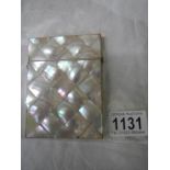 A mother of pearl card case in good condition.