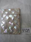 A mother of pearl card case in good condition.