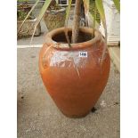 A circular terracotta garden urn. COLLECT ONLY.