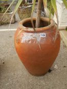 A circular terracotta garden urn. COLLECT ONLY.