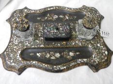 An antique mother of pearl inlaid inkstand.