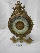 A 19th century brass barometer, made in Paris.