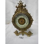 A 19th century brass barometer, made in Paris.