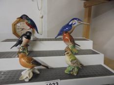 Three Beswick birds, a Royal Copenhagen bird and two others.