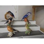 Three Beswick birds, a Royal Copenhagen bird and two others.