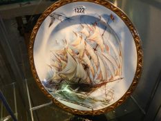 A large platter featuring a sailing ship.