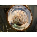 A large platter featuring a sailing ship.