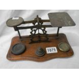 A set of early 20th century brass postal scales.