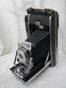 A vintage folding Polaroid camera.