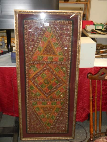 A framed Indian silk beaded wall hanging, 134cm high, COLLECT ONLY.