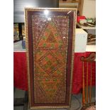 A framed Indian silk beaded wall hanging, 134cm high, COLLECT ONLY.