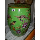 A Chinese hand painted ceramic garden stool featuring birds.