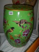 A Chinese hand painted ceramic garden stool featuring birds.