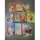 Five Rupert annuals and five other children's annuals.