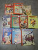 Five Rupert annuals and five other children's annuals.