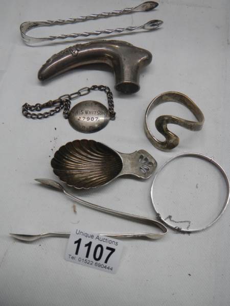 A mixed lot including silver bangle and various plated items.