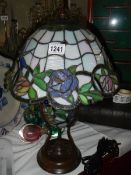 A table lamp with Tiffany style shade.