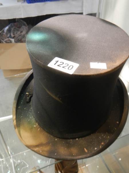A vintage collapsible top hat with spring action.