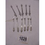 A set of six silver cocktail forks and five other silver cocktail forks, 52 grams.