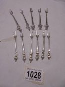 A set of six silver cocktail forks and five other silver cocktail forks, 52 grams.