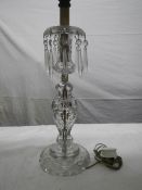 A Victorian cut glass table lamp.