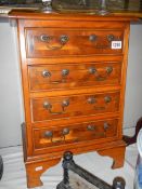 A small 20th century four drawer chest.