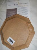 A Robert Thompson 'Mouseman' small chopping board/teapot stand.