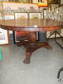 A Victorian rosewood tip top dining table.