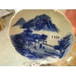 A Japanese blue and white hand painted plate.