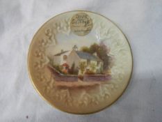 An early Royal Worcester hand painted plate depicting Dove Cottage Grasmere.