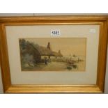 A gilt framed and glazed watercolour featuring a thatched cottage, signed F Meginn.
