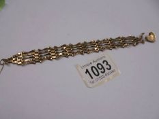 A 9ct gold gate bracelet with padlock (safety chain broken). 9.9 grams.