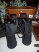 A leather cased pair of King 30 x 70 binoculars.