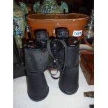 A leather cased pair of King 30 x 70 binoculars.