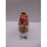 A Royal Crown Derby squirrel paperweight with silver stopper.